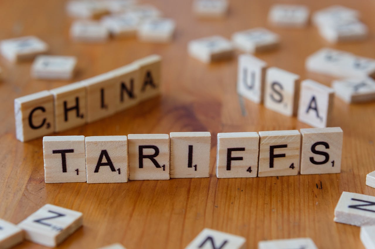 services-01 Wooden letter blocks spelling tariffs, China, and USA representing trade relations.